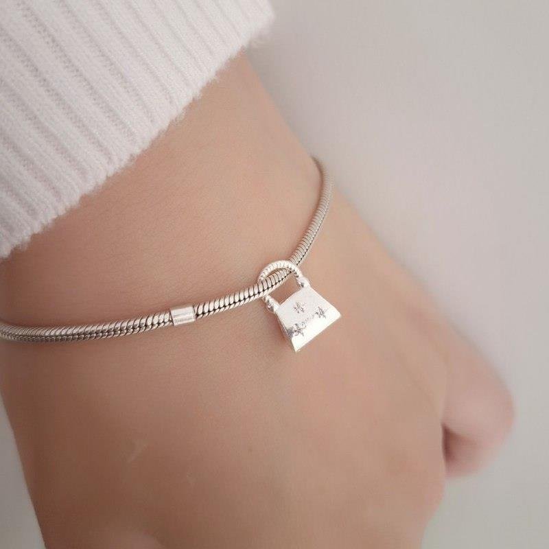 BERLOQUE PRATA 925 BOLSA CRAVEJADA MICROZIRCONIAS