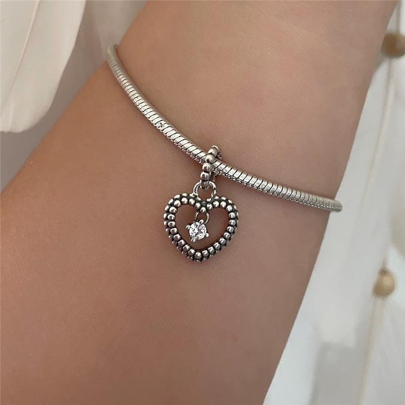 BERLOQUE PRATA 925 CORAÇÃO VAZADO COM ZIRCÔNIA PENDURADA NO MEIO