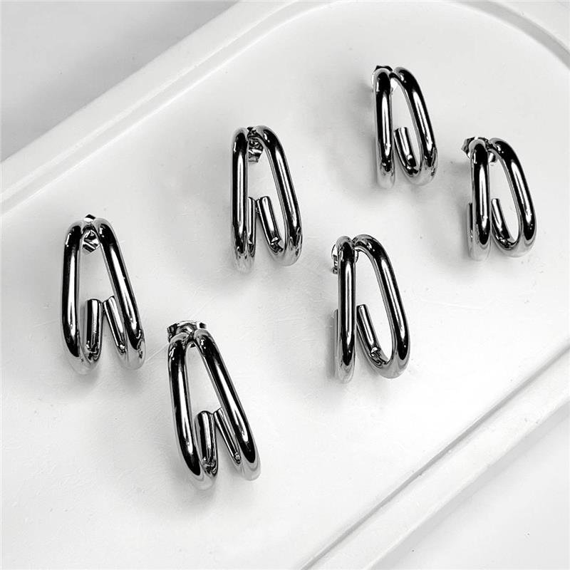BRINCO AÇO INOX MEIA ARGOLA OVAL DUPLA 'G'