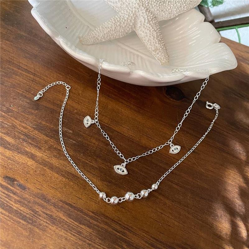 TORNOZELEIRA PRATA 925 COM OLHO GREGO PENDURADO